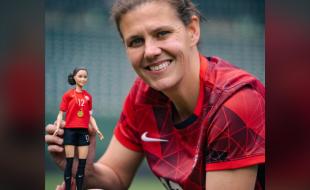 Christine Sinclair and the Barbie doll made in her honour. (Photo: CNW Group/Mattel Canada.)